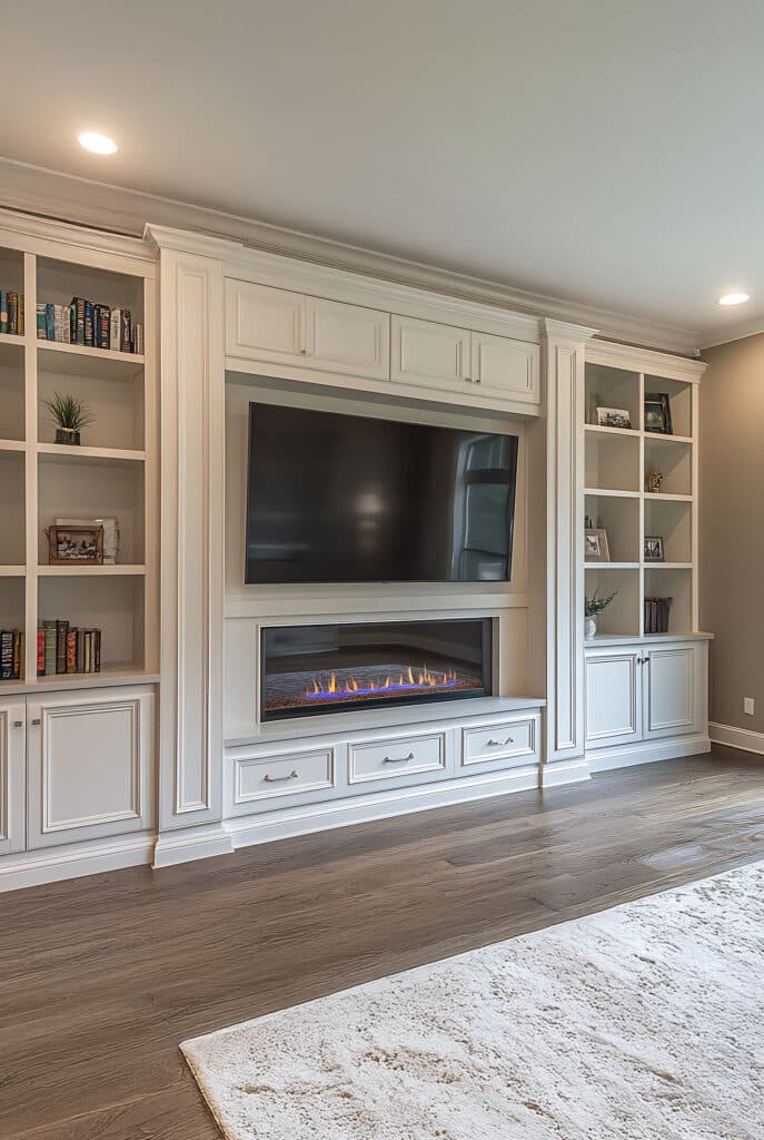Traditional shaker-style media wall with TV shelves and bioethanol fire